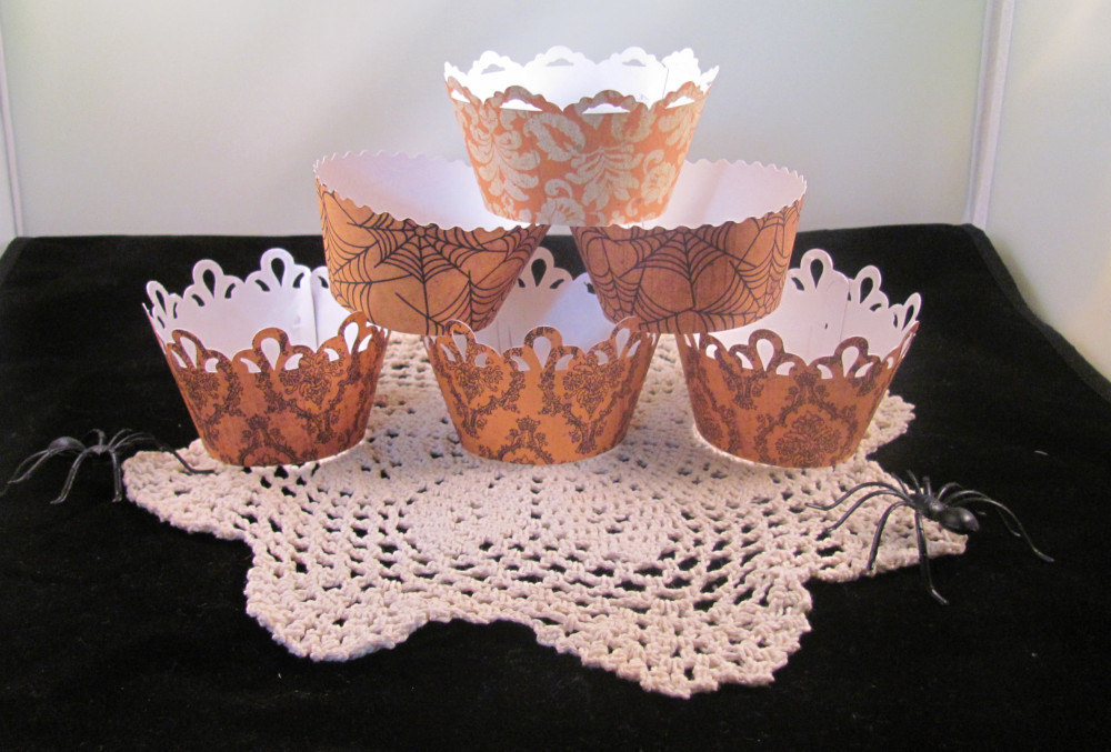 Halloween Cupcake Wrappers Featuring Orange Damask Paper For A Vintage Look